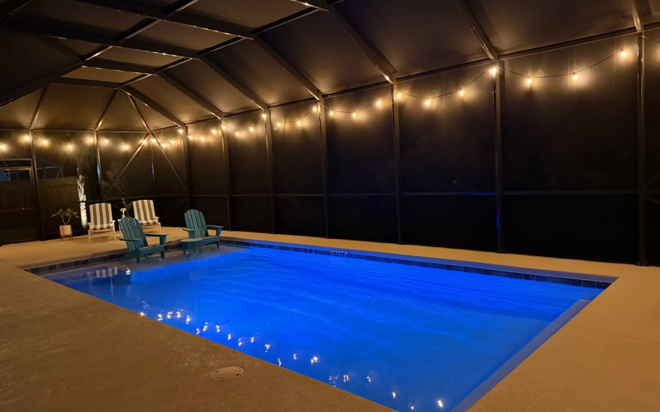 Night-Time Illuminated Bistro/String Lights Around Pool Cage