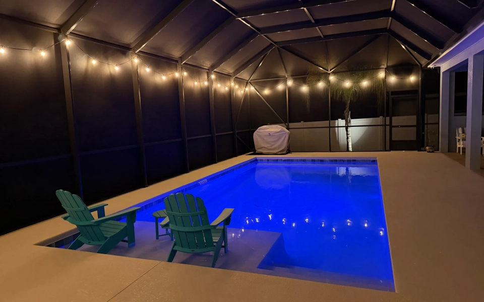 Night-Time Illuminated Bistro/String Lights Around Pool Cage